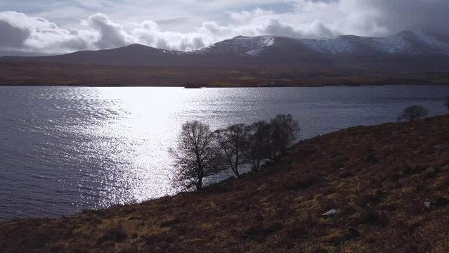 Car point of view, POV driving along a landscape and scenery through beautiful roads in the Scottish highland.