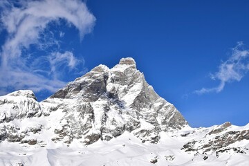 Beautiful snowcapped Matterhorn from ski slopes in Cervinia Valtournenche ski resort, Italian Alps. Snowy mountain peak that borders Italy and Switzerland.