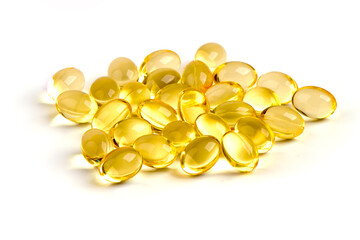 Fish oil supplement fish shape capsules, isolated on white background.