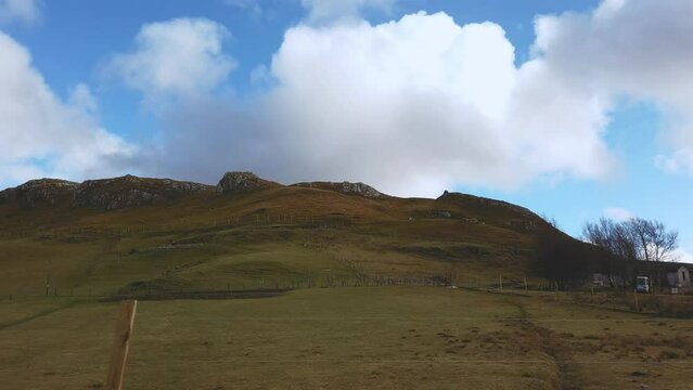 Car point of view, POV driving along a landscape and scenery through beautiful roads in the Scottish highland.