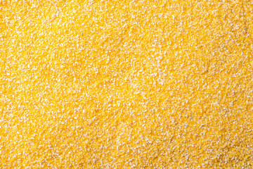 The texture of corn groats. Crushed corn for food. An ingredient for porridge and corn soups.