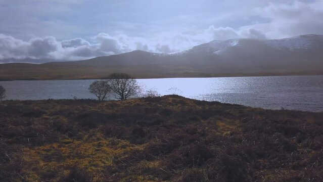 Car point of view, POV driving along a landscape and scenery through beautiful roads in the Scottish highland.