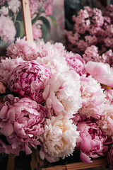 a large bouquet of pink and white flowers peonies