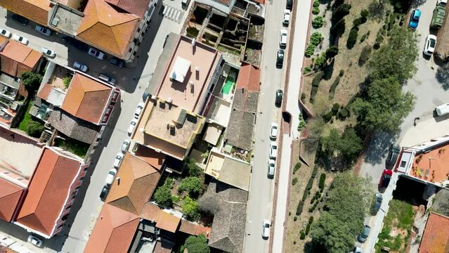 Hill town of Silves, Algarve, Portugal during spring, cobbled streets and orange roofs by 4K drone