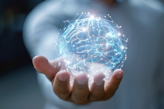 digital brain hologram spinning above male human hand