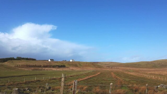 Car point of view, POV driving along a landscape and scenery through beautiful roads in the Scottish highland.