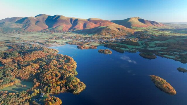 Aerial footage of Derwentwater and the Skiddaw mountain range, Keswick, Lake District National Park, Cumbria, England, United Kingdom