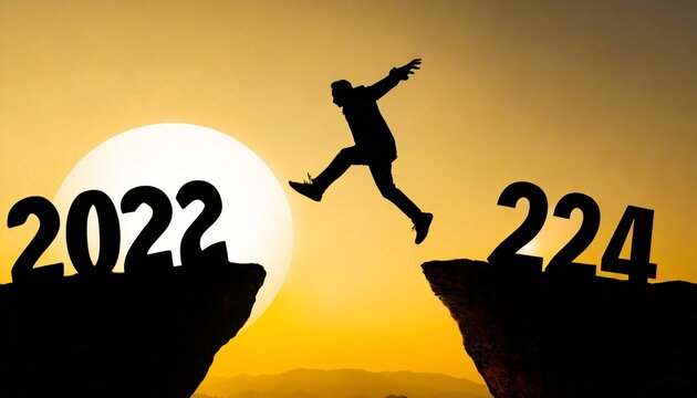 silhouette man jump happy new year 2024 concept man jumping over barrier cliff and success from 2023 cliff to 2024 cliff with sunset background happy new year for web banner and advertisement