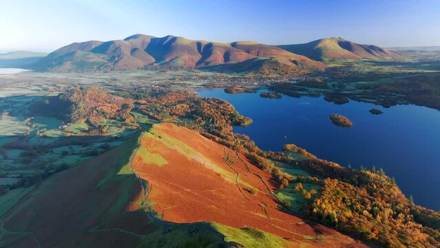 Aerial footage of Derwentwater and the Skiddaw mountain range, Keswick, Lake District National Park, Cumbria, England, United Kingdom
