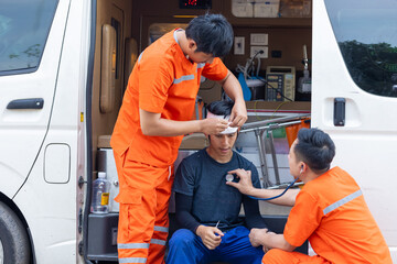 paramedic mobile car medical emergency team working in action help first aid save people life at...