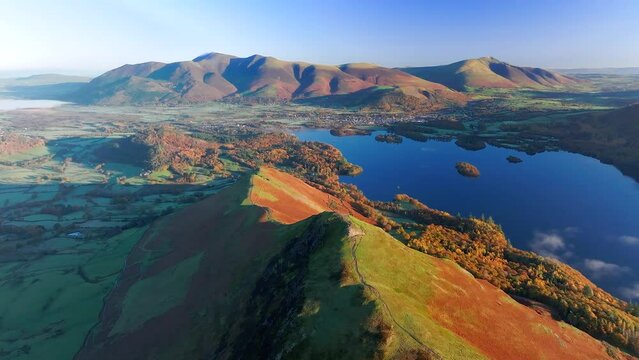 Aerial footage of Derwentwater and the Skiddaw mountain range, Keswick, Lake District National Park, Cumbria, England, United Kingdom