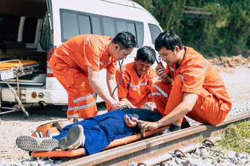 paramedic,medical,emergency,doctor,team,working,in,action,help,first,aid,save,people,life,at,accident,site,outdoors