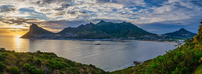 Fototapeten Hout Bay town and the fishermans village during a colorful sunset, Cape Town, South Africa © Arnold