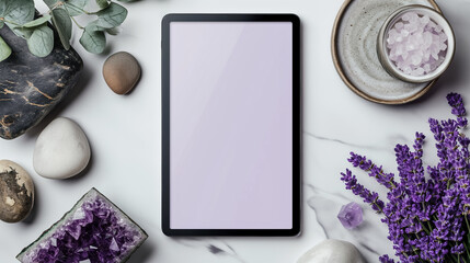 Tablet with a blank screen in a mockup, positioned next to an elegant amethyst gemstone, placed on a pristine white desk
