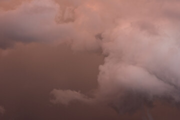 Fototapeta na wymiar beautiful pink, thunderclouds in the sky. The sky before the storm
