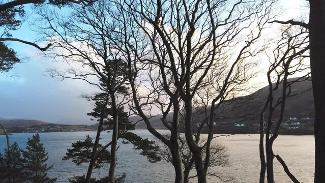 View of beautiful countryside in the Scottish highland with mountains, trees and sea