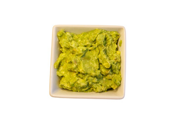 Bowl of guacamole isolated on white background