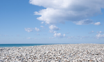 White pebble beach, cloudy sky, Nature landscape background