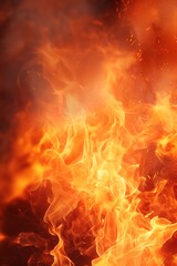Vivid close-up of a blazing fire with dynamic flames, ideal for themes related to energy, warmth, cooking, or outdoor activities. Vertical background with fire.