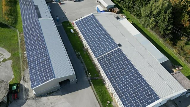 Industrial warehouse with sollar panels on the roof top in a small county side village.