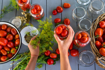 Preserving tomatoes in jars. Selective focus.