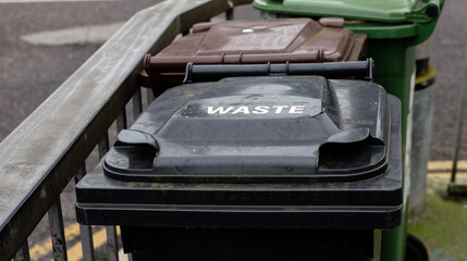 Plastic bins for separate waste close-up on city street