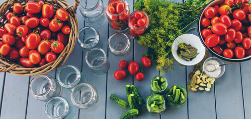 Preserving tomatoes in jars. Selective focus.
