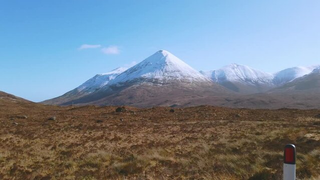 Car point of view, POV driving along a landscape and scenery through beautiful roads in the Scottish highland.