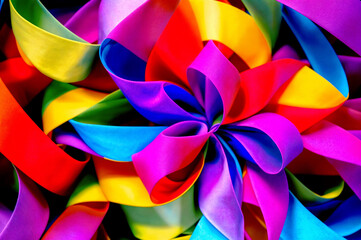 Colorful ribbons twisting and turning, forming heart shapes as they gracefully move through the air. ai generative