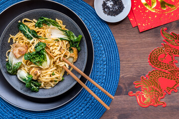 A spicy pork, vegetable and longevity noodles for Chinese New Year.