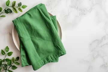 Green kitchen napkin on table background Folded cloth for mockup with copy space Minimalist flat lay
