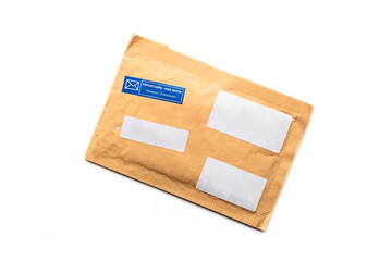 Padded envelope with stamps top view isolated on white background, cardboard bag, package paper letter. - 725810631