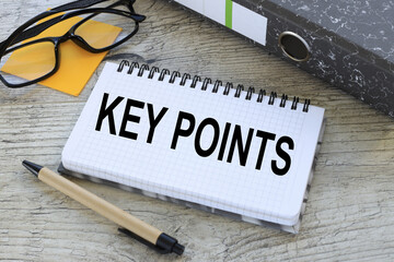 KEY POINTS. gray folder and glasses on stickers. text on paper