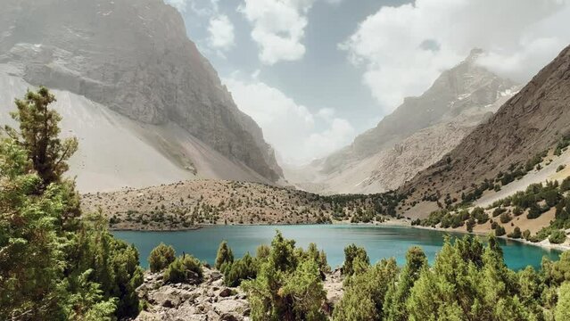 The Alaudin (Chapdara) lakes, lying at an altitude of 2800 m, are considered one of the most beautiful lakes of the Fan Mountains. Turquoise mountain lake. Pamiro-Alai. Tajikistan, Pamir 4K