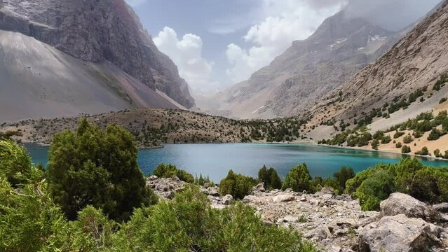 The Alaudin (Chapdara) lakes, lying at an altitude of 2800 m, are considered one of the most beautiful lakes of the Fan Mountains. Turquoise mountain lake. Pamiro-Alai. Tajikistan, Pamir 4K