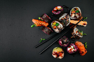 Elegance meets flavor as sushi varieties take their place on a black background, inviting connoisseurs to partake in a visual and gustatory feast at restaurant