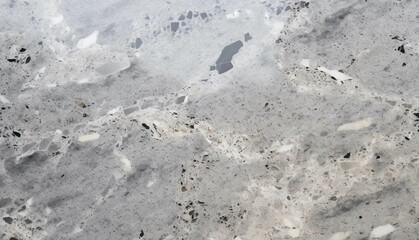 shiny grey, white, and black composite stone floor background