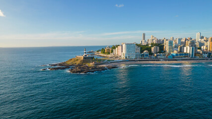 Aerial view by the sea of the Barra Lighthouse in Salvador, Bahia, Brazil
