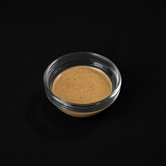 Peanut sauce. Cheese sauce in a gravy boat.