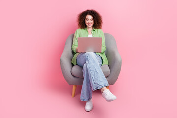 Full length body photo of optimistic cheerful young woman team lead using new macbook pro in...