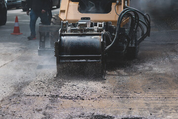 Process of asphalting, blacktopping and paving, asphalt paver machine and steam roller compactor during construction and repairing works, workers on the construction site, rental vehicle working - obrazy, fototapety, plakaty