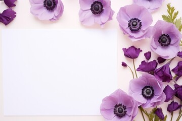 spring purple, lilac, violet anemone flowers and empty white paper mock up