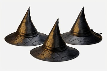 Fototapeta premium Three black and gold witch hats on a white background. Perfect for Halloween-themed designs and decorations