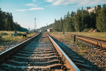 Fototapeta premium railway going into the distance towards the station