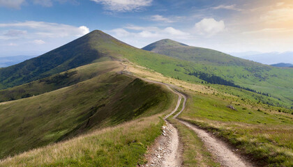Experience the thrill of driving on a dirt road that winds through breathtaking mountain peaks.