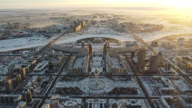 Drone flight above Astana city center with skyscrapers and Baiterek Tower. Capital of Kazakhstan, Qazaqstan.