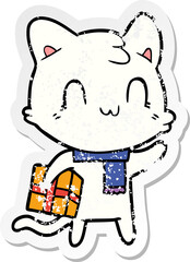 distressed sticker of a cartoon happy cat wearing scarf