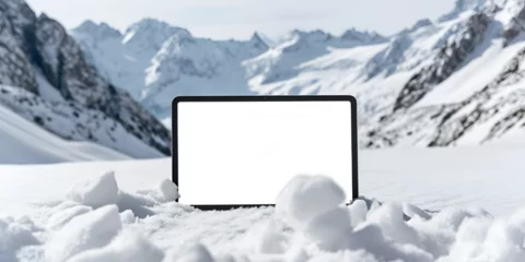 Fotobehang Winter advertising tablet mock-up with a white screen, tablet mock-up laying in snow on the background of a mountain. The present concept for St.Valentine's day. © Only AI