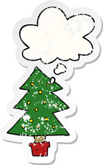 cartoon christmas tree and thought bubble as a distressed worn sticker