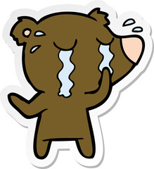 distressed sticker of a cartoon bear crying